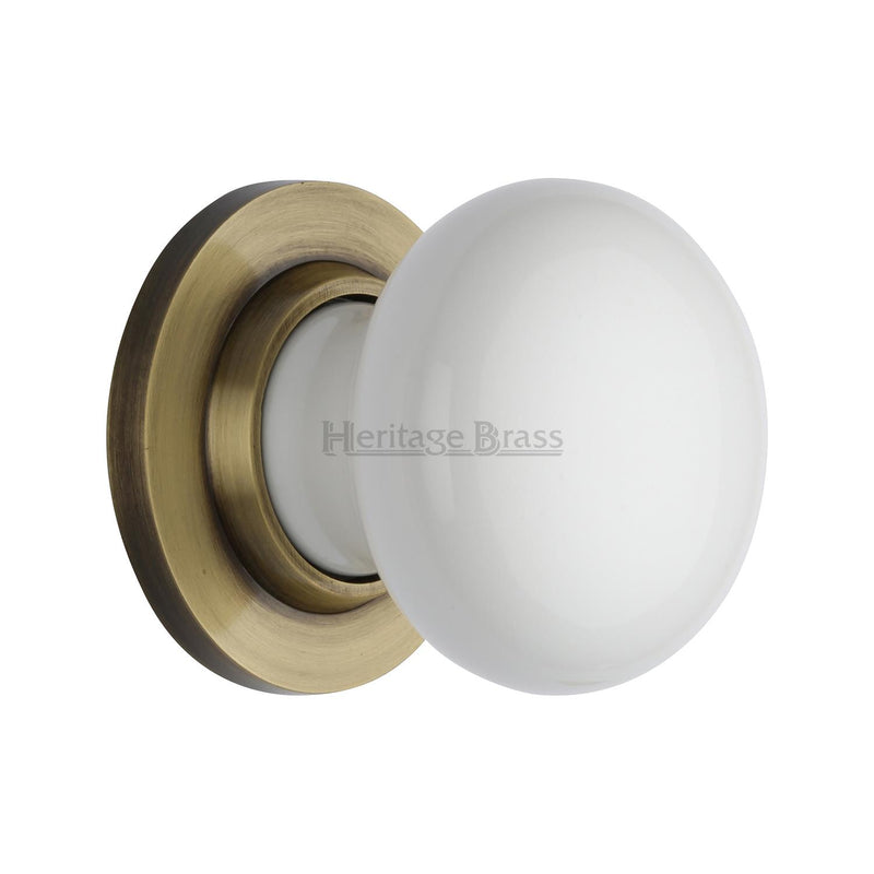 White Knob with Antique Brass base
 - 5010-AT - Choice Handles