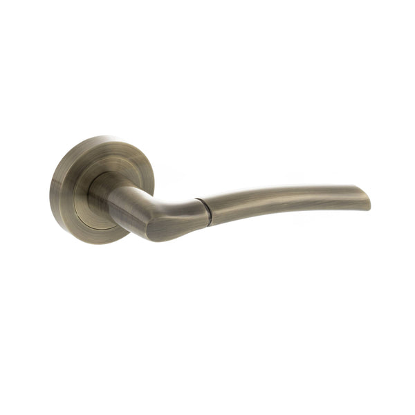 STATUS Indiana Lever Door Handle on Round Rose - Antique Brass - S33RAB