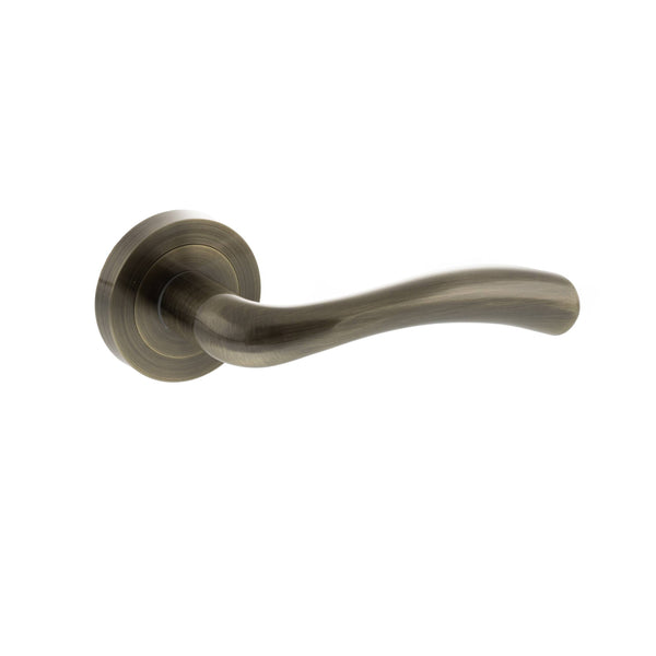 STATUS Texas Lever Door Handle on Round Rose - Antique Brass - S35RAB