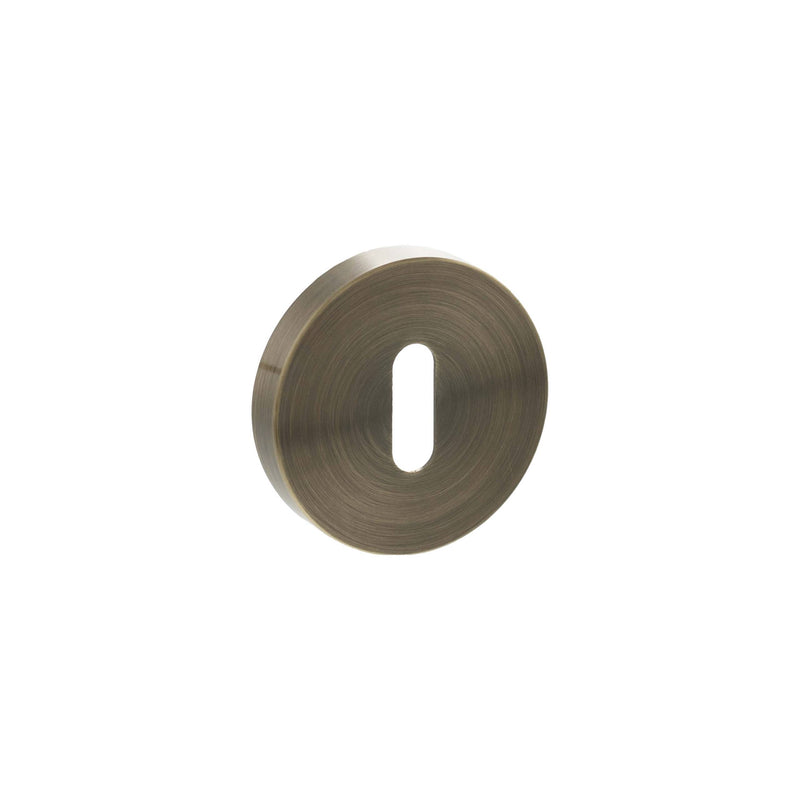 Senza Pari Key Escutcheons on Minimal Round Rose - Antique Brass - SPRESCKAB