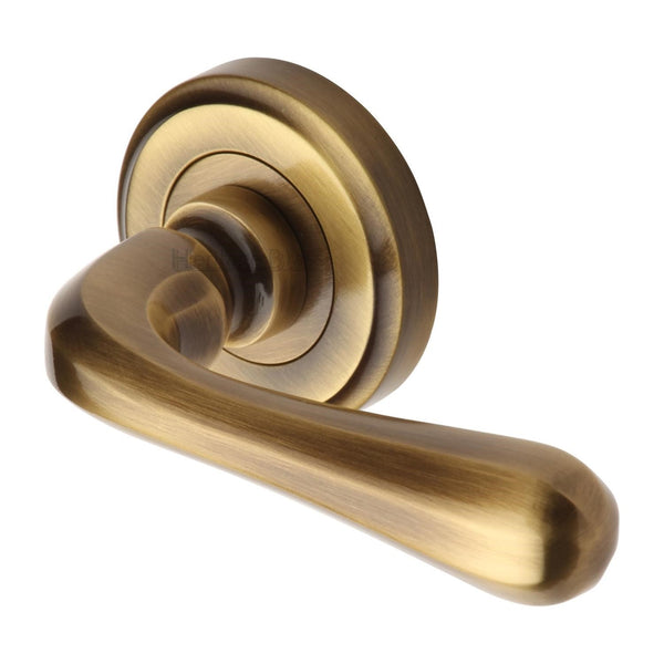 Heritage Brass Door Handle Lever Latch on Round Rose Charlbury Design Antique finish - V3020-AT - Choice Handles