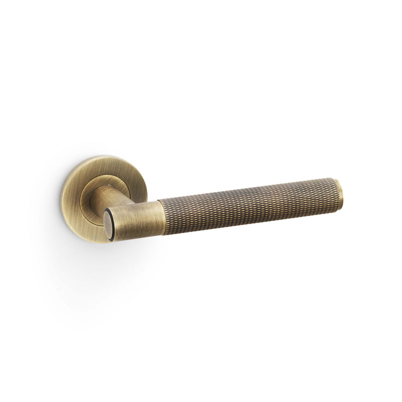 Alexander and Wilks - Spitfire Knurled Lever on Round Rose - Antique Brass - AW220AB