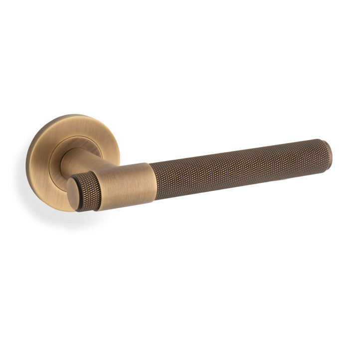 Alexander & Wilks Knurled Kingstone Lever on Round Rose - Antique Brass - AW240AB