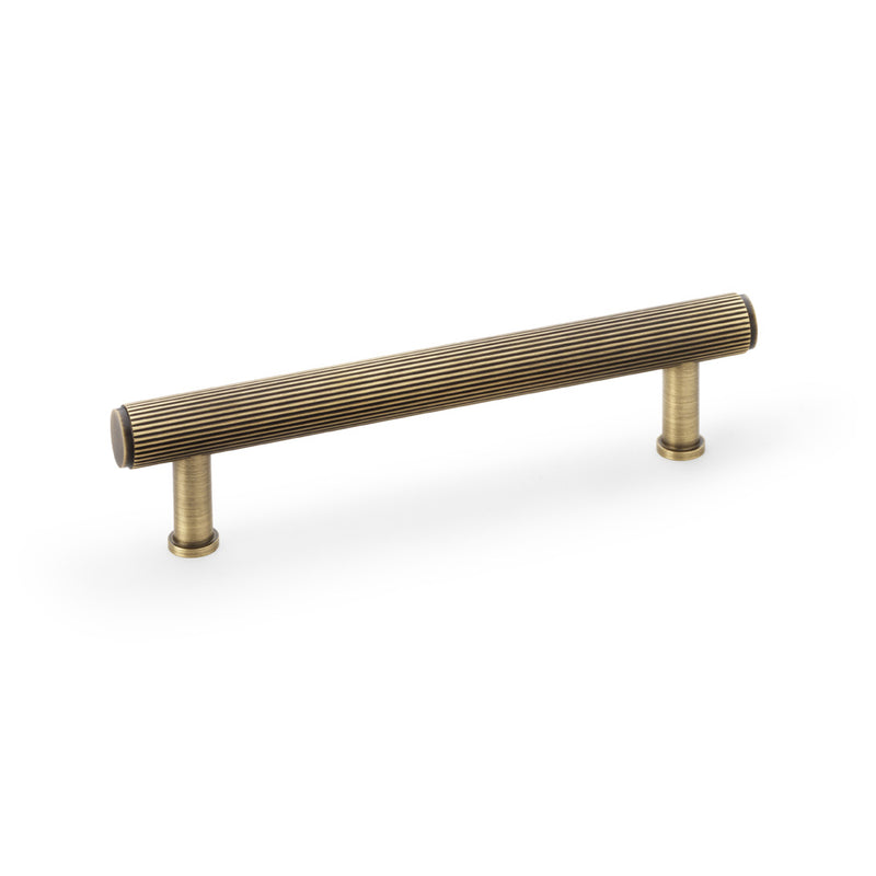 Alexander and Wilks - Crispin Reeded T-bar Cupboard Pull Handle - Antique Brass - 128mm - AW809R-128-AB