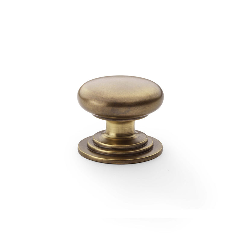 Alexander and Wilks - Waltz Round Cupboard Knob on Stepped Rose - Antique Brass - Knob 38mm - AW825-38-AB