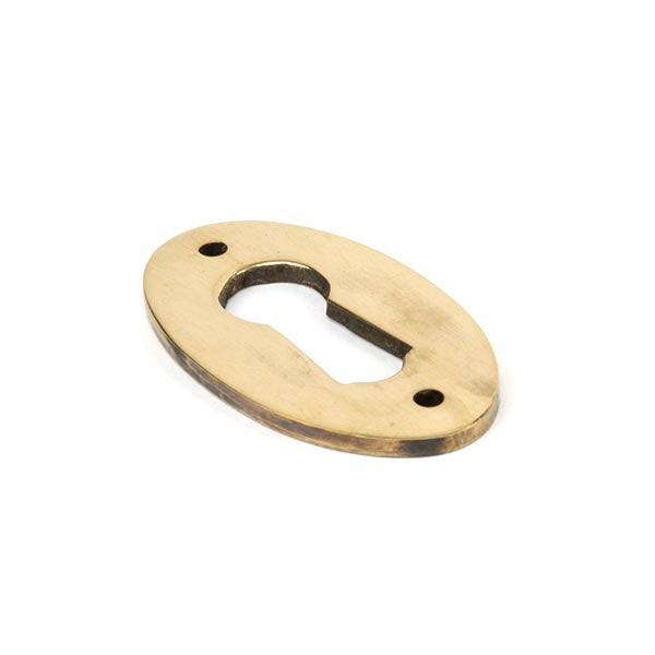 From The Anvil - Oval Escutcheon - Aged Brass - 83818 - Choice Handles